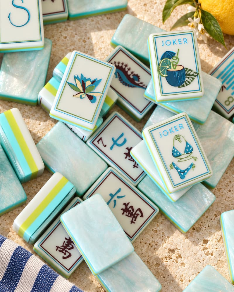 Seaglass Set tiles scattered on a sunny table, with seafoam pearlescent backs and seaside designs